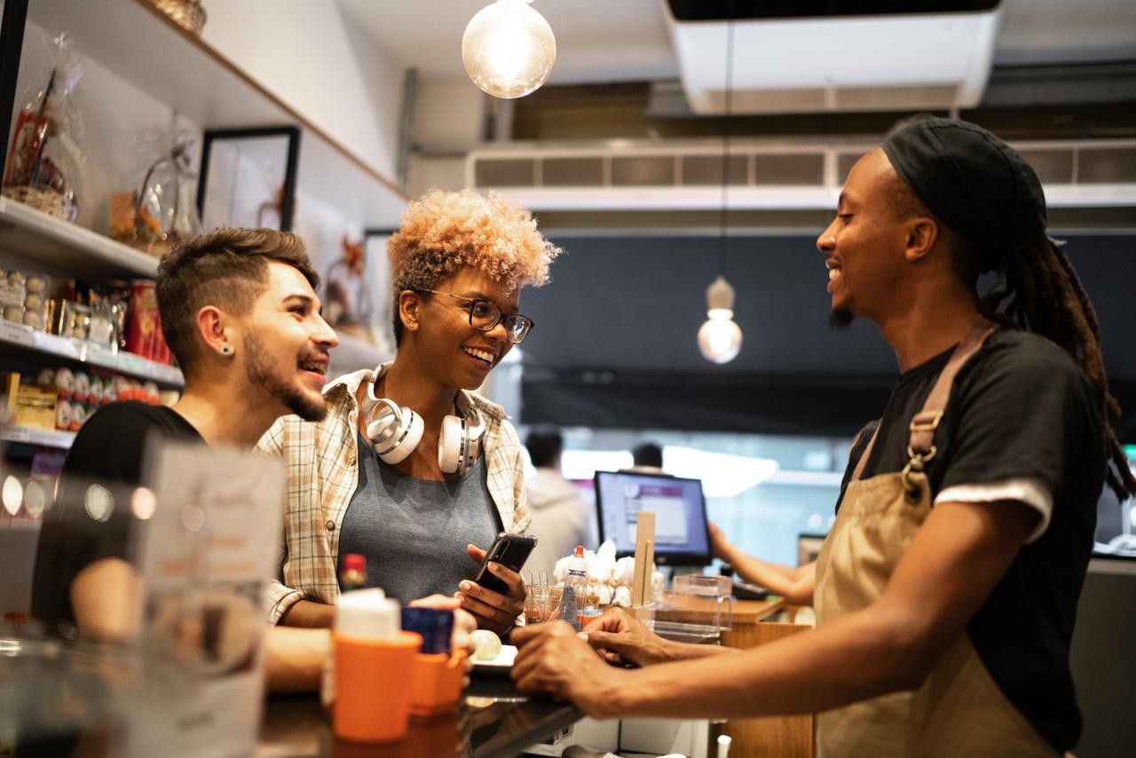 Coworkers talking at coffee shop